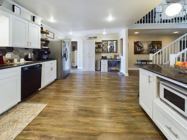 kitchen with white cabinetry, dark wood-type flooring, dark stone counters, and black dishwasher