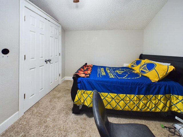 carpeted bedroom with a textured ceiling