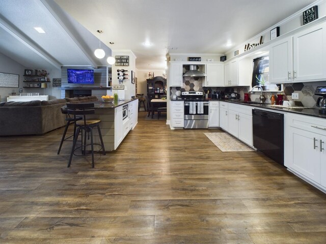 kitchen with pendant lighting, tasteful backsplash, black dishwasher, white cabinets, and electric stove