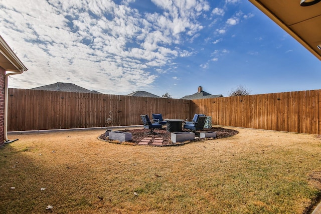 view of yard featuring a fire pit