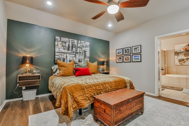 bedroom featuring wood-type flooring, connected bathroom, and ceiling fan