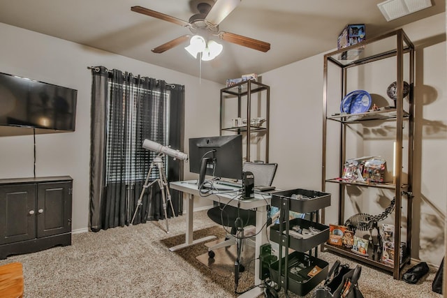 carpeted office with ceiling fan