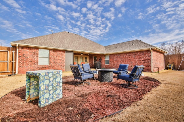 rear view of house with a fire pit