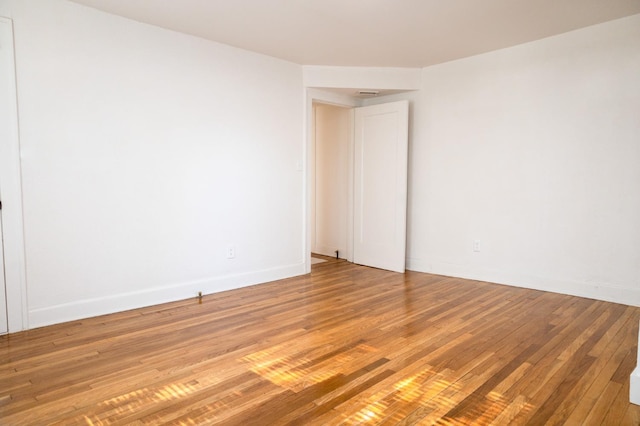 unfurnished room with light hardwood / wood-style flooring