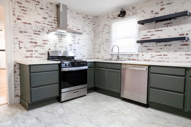 kitchen with wall chimney exhaust hood, stainless steel appliances, and sink