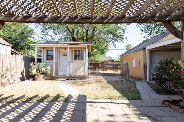 view of outdoor structure with a pergola