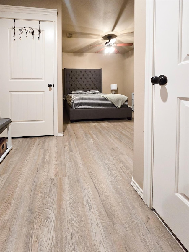 bedroom featuring ceiling fan and light wood-type flooring