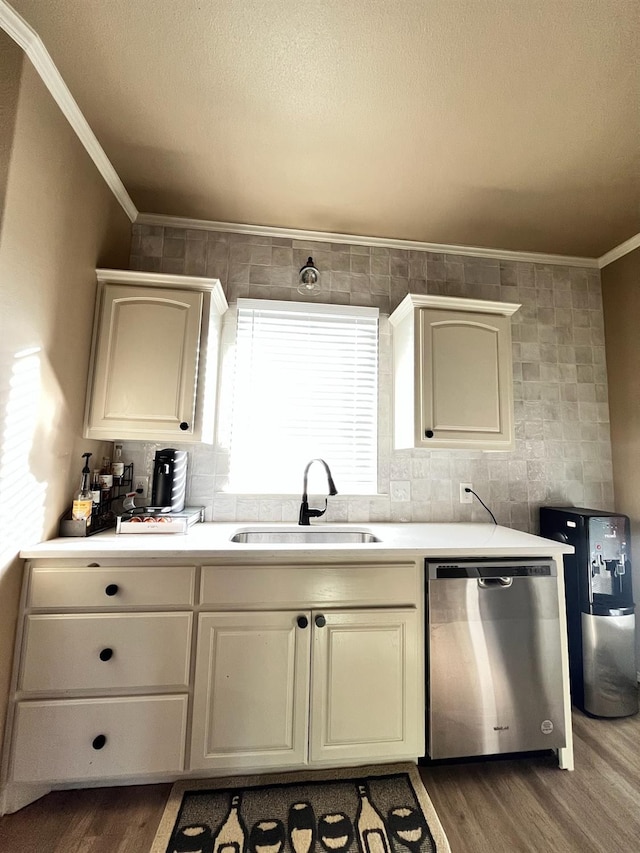 kitchen with sink, crown molding, dishwasher, dark hardwood / wood-style floors, and a textured ceiling