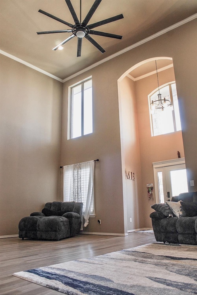 entryway featuring hardwood / wood-style flooring, plenty of natural light, and ornamental molding