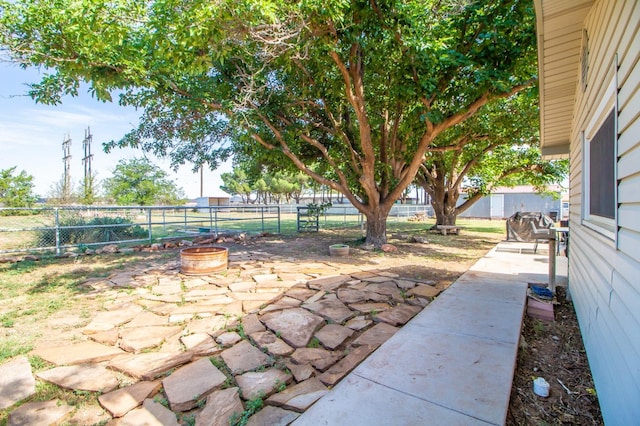 view of patio / terrace with an outdoor fire pit