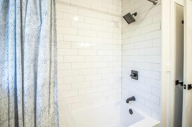 bathroom with shower / bath combination with curtain