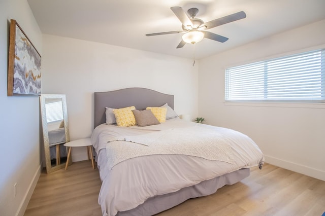 bedroom featuring ceiling fan and light wood-type flooring