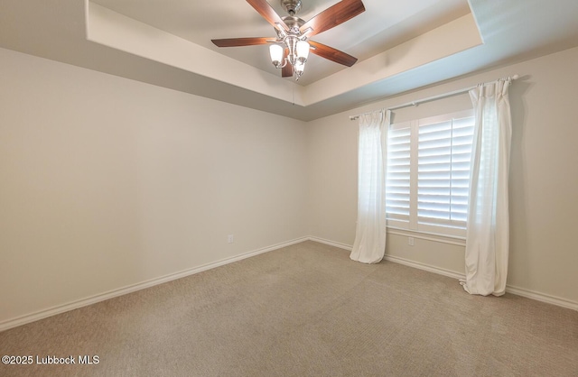 4003 124th St, Lubbock, TX 79423 - carpeted empty room featuring a tray ceiling and ceiling fan