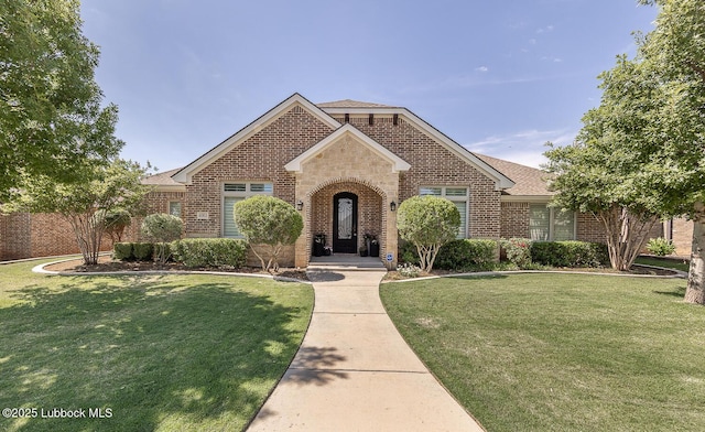 4003 124th St, Lubbock, TX 79423 - traditional-style house featuring brick siding and a front lawn