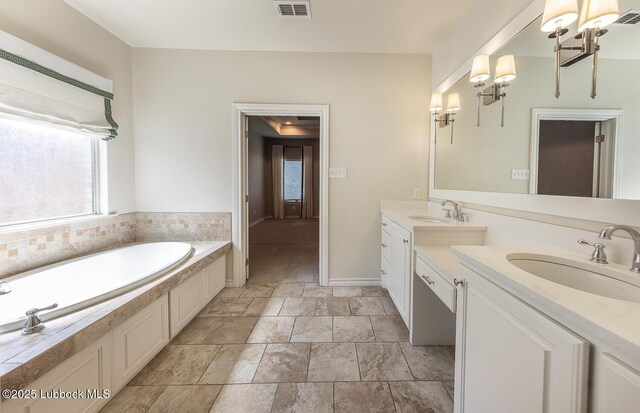 4003 124th St, Lubbock, TX 79423 - full bathroom featuring plenty of natural light, vanity, a chandelier, and a bath