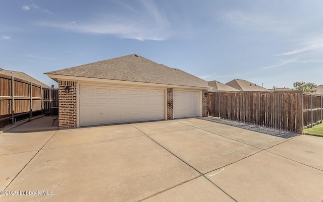 4003 124th St, Lubbock, TX 79423 - view of property exterior with brick siding and a garage
