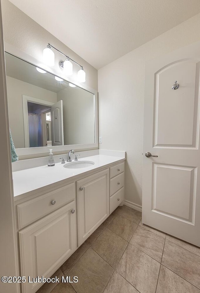 4003 124th St, Lubbock, TX 79423 - bathroom with vanity and tile patterned floors