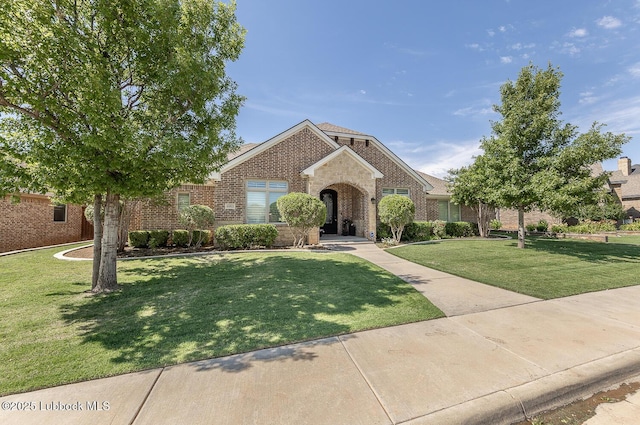 4003 124th St, Lubbock, TX 79423 - traditional-style house with brick siding and a front yard