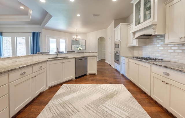 4003 124th St, Lubbock, TX 79423 - kitchen with appliances with stainless steel finishes, a chandelier, backsplash, recessed lighting, and white cabinets