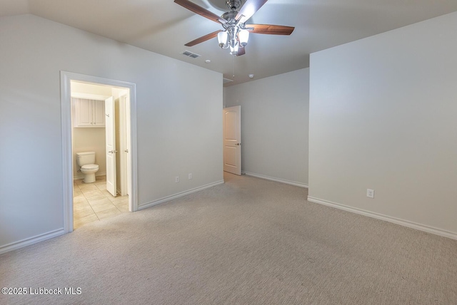 4003 124th St, Lubbock, TX 79423 - unfurnished bedroom with carpet flooring, connected bathroom, tile patterned flooring, and a ceiling fan