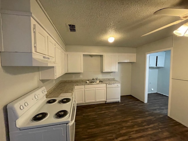 kitchen with sink, white appliances, dark wood-type flooring, ceiling fan, and white cabinetry