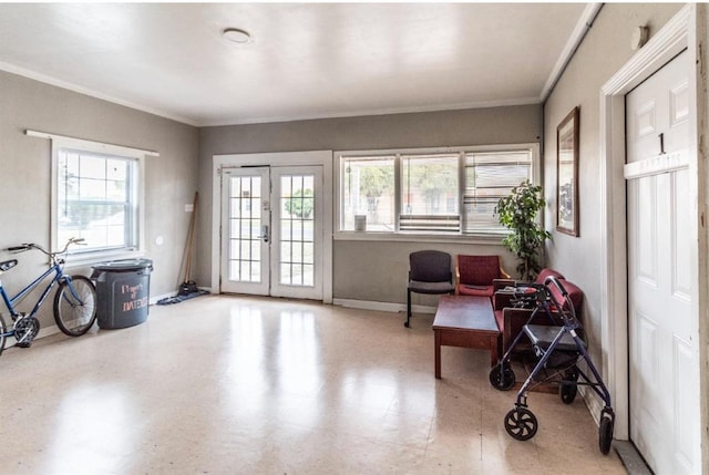 living area with french doors and ornamental molding