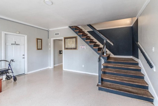 staircase featuring crown molding