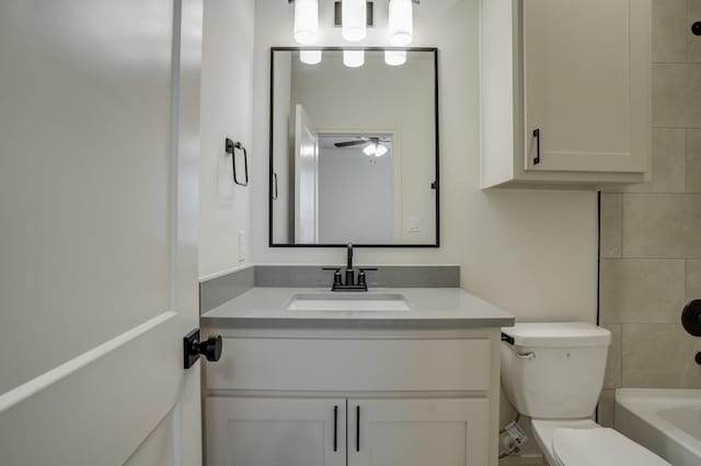 bathroom with ceiling fan, vanity, and toilet