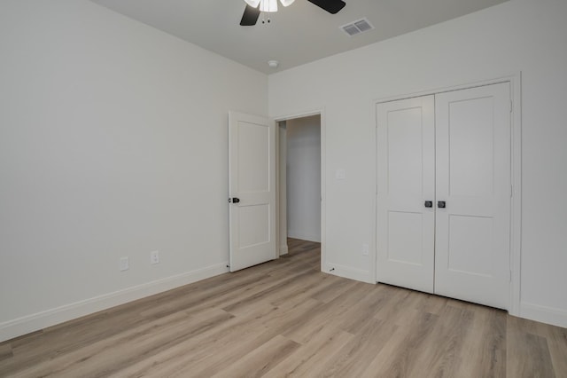 unfurnished bedroom featuring a closet, ceiling fan, and light hardwood / wood-style floors