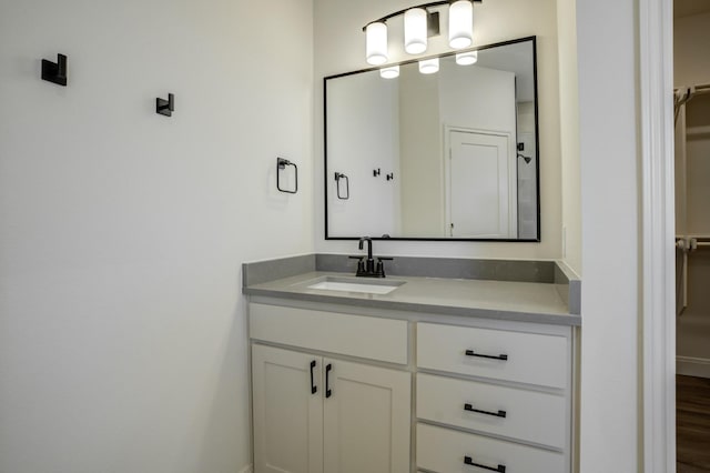 bathroom with hardwood / wood-style flooring and vanity