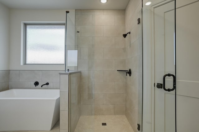 bathroom featuring plus walk in shower