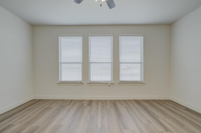 unfurnished room with ceiling fan and light hardwood / wood-style floors