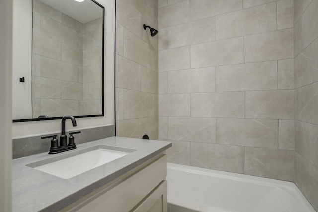 bathroom featuring vanity and tiled shower / bath combo