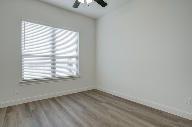 unfurnished room featuring ceiling fan and light hardwood / wood-style floors