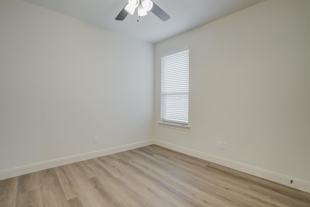 empty room featuring light hardwood / wood-style flooring and ceiling fan