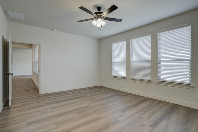 unfurnished room featuring ceiling fan and light wood-type flooring