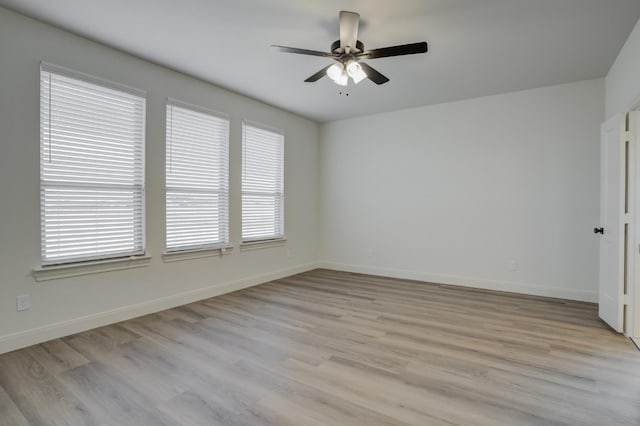 unfurnished room with ceiling fan, light hardwood / wood-style flooring, and a healthy amount of sunlight