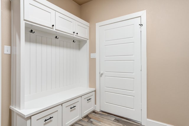 mudroom with light wood-type flooring and baseboards