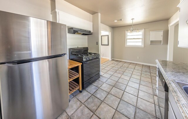 kitchen featuring pendant lighting, stainless steel appliances, and white cabinets