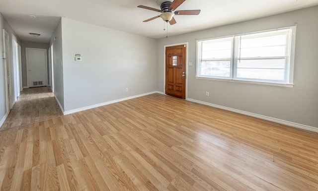 spare room with ceiling fan and light hardwood / wood-style flooring