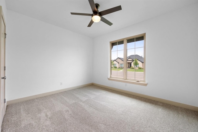 unfurnished room with ceiling fan and carpet floors