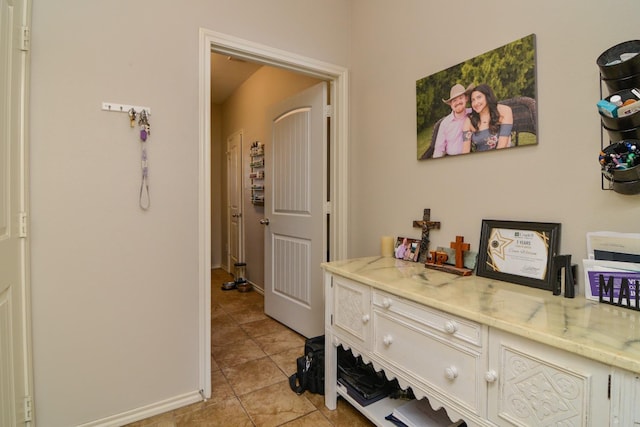 hallway featuring light tile patterned floors