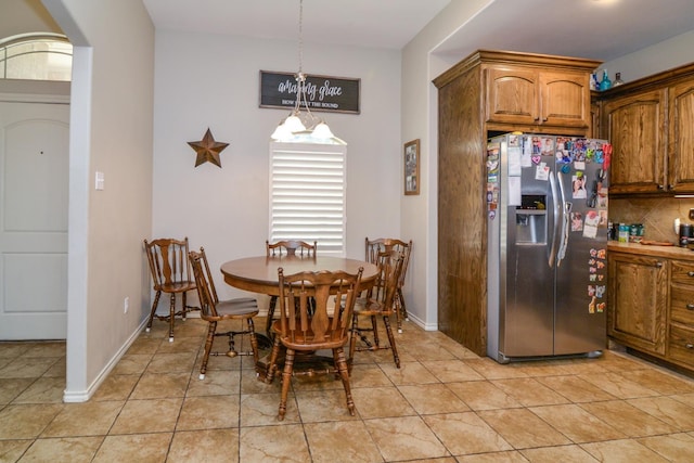 dining area featuring light tile patterned floors