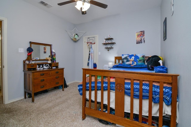 bedroom with light carpet and ceiling fan