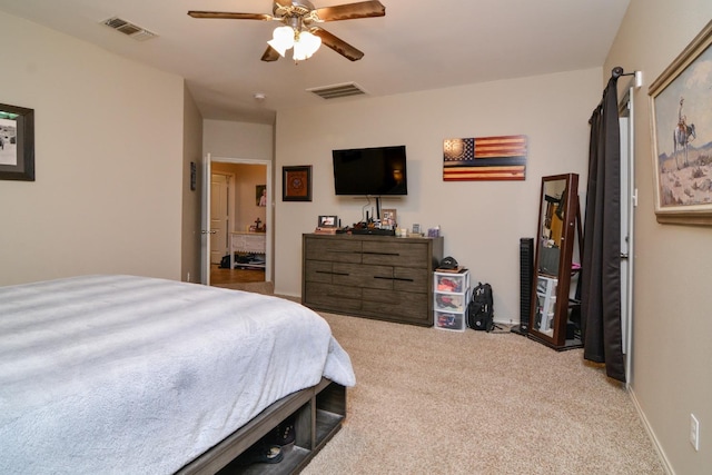 bedroom with ceiling fan and light colored carpet