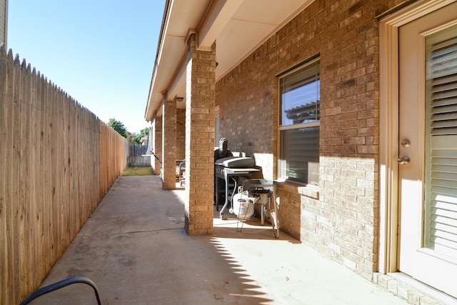 view of side of property with a patio