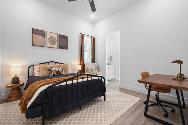 bedroom with wood-type flooring and ceiling fan