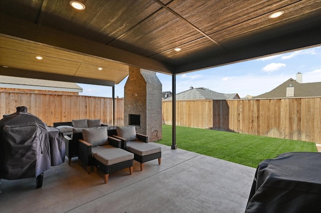 view of patio featuring an outdoor living space with a fireplace