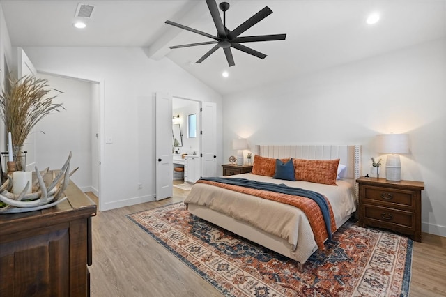 bedroom with vaulted ceiling with beams, ensuite bath, light hardwood / wood-style flooring, and ceiling fan