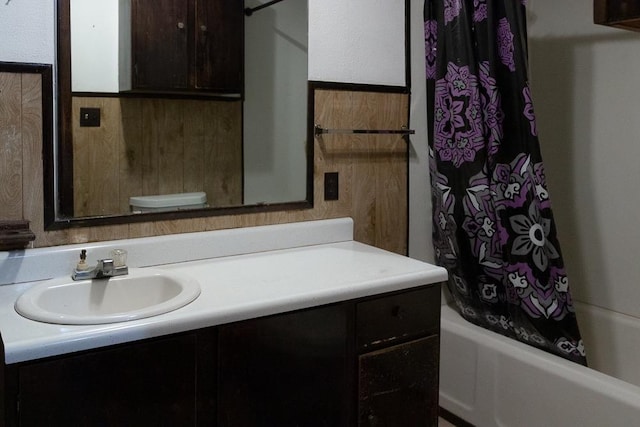 full bathroom with vanity, toilet, and shower / tub combo with curtain